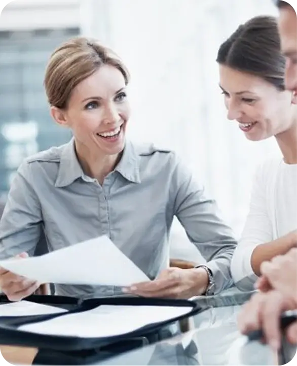Smiling advisor presenting financing papers to clients
